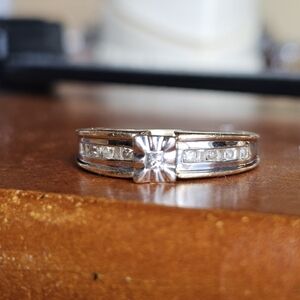 10k diamond ring size 7. Resizeable by a jeweler. Stamped 10k. Genuine diamonds.